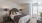 a bedroom with a bed and lamps