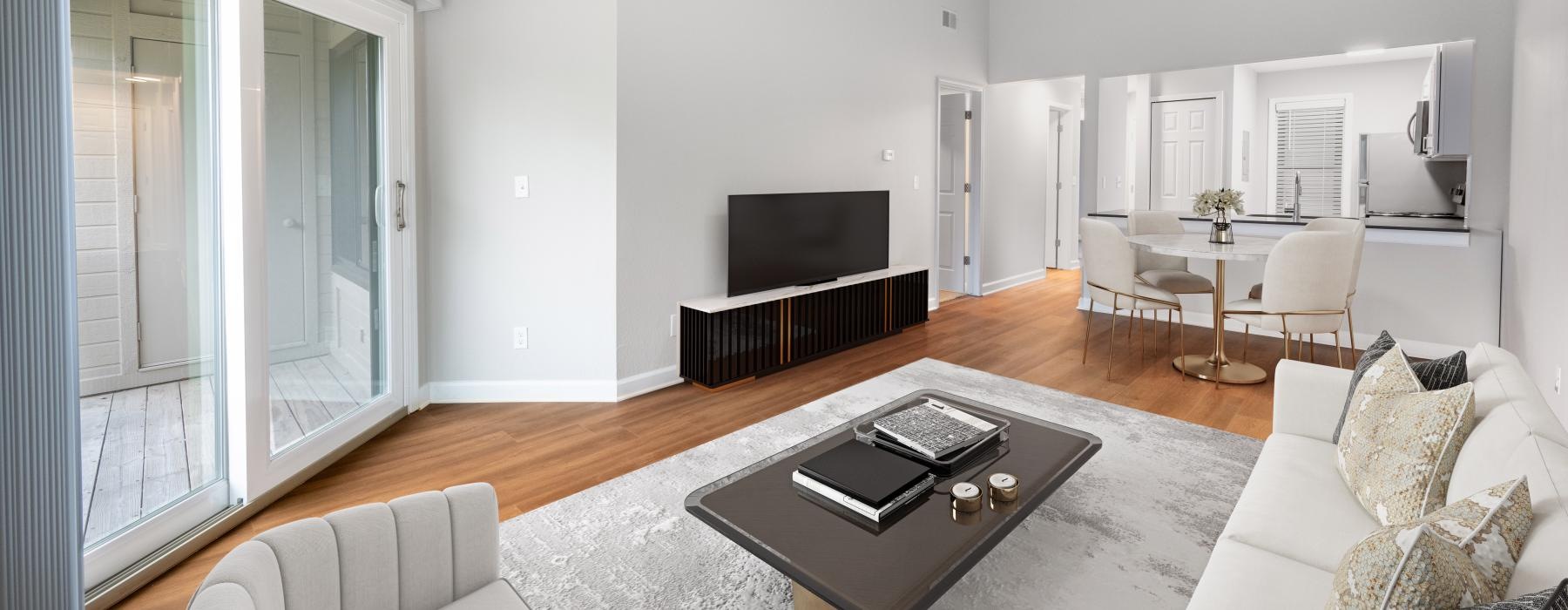 a living room with a tv and coffee table