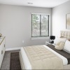 bedroom with a dresser, bed and large nightstand