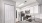 a kitchen with white cabinets