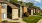 apartment buildings with lawn in front and window
