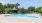 a pool with a gazebo in the background